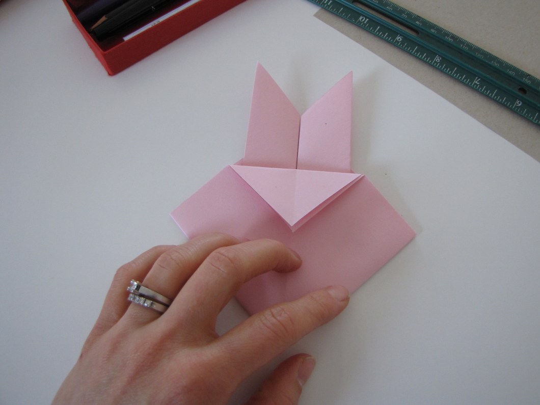 Bend the top corners down.