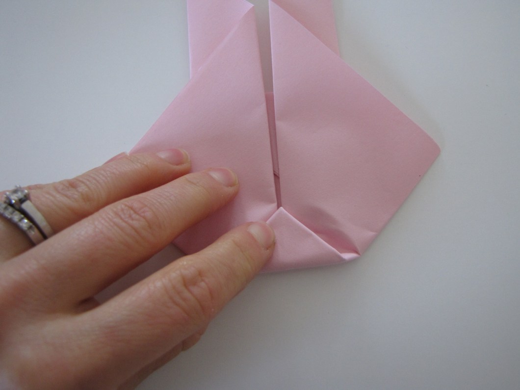 Bend the bottom corner up.