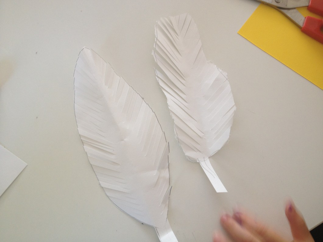 make long cuts all along both sides of your feathers