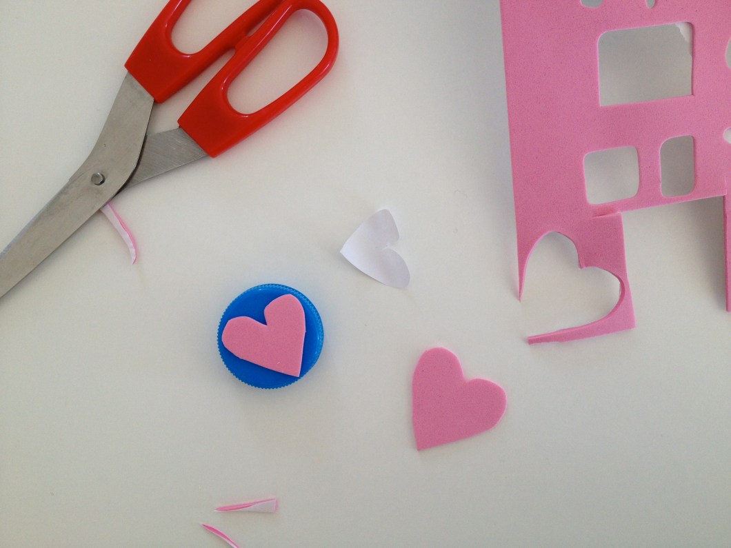 make a stamp out of bottle tops and foam with a sticker backing
