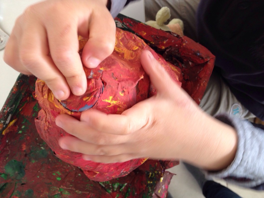 Press on the bottle top to help push it out of the volcano.