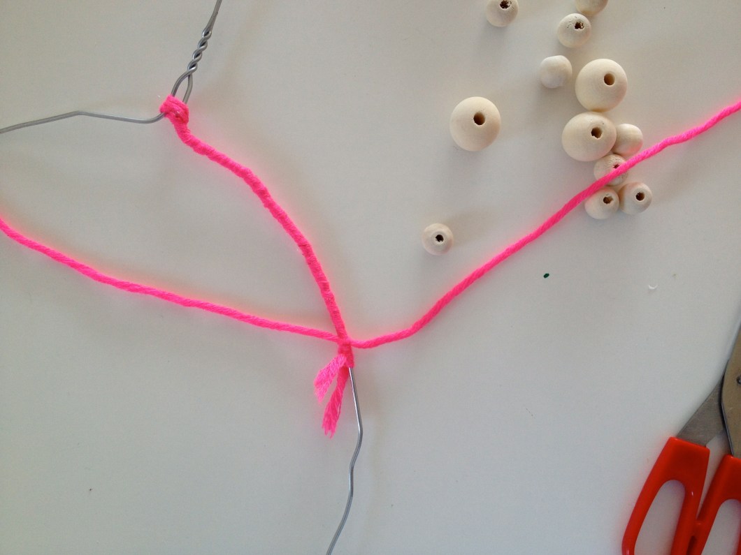 Start with a new piece of wool and knot it just above your previous knot.