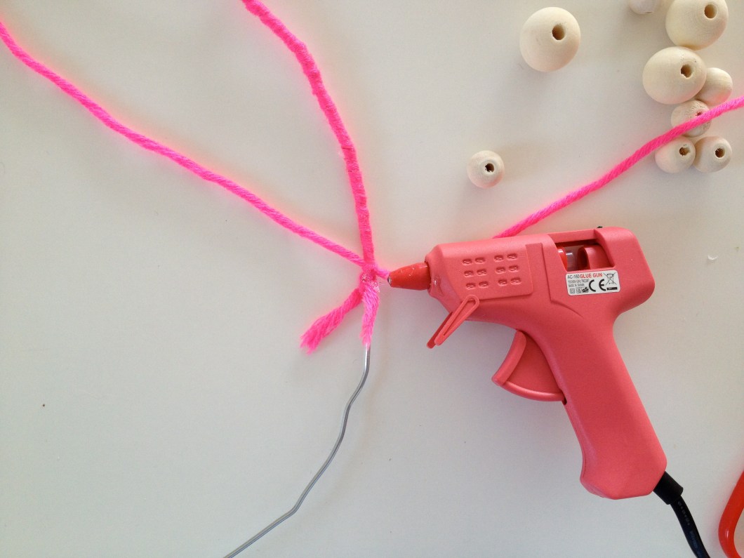 Add some hot glue before making another knot so as to hold it in place.