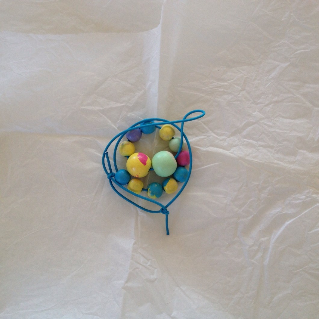 Wrap up the necklace in some tissue paper (our tissue paper came from the fresh flowers that we purchased too).