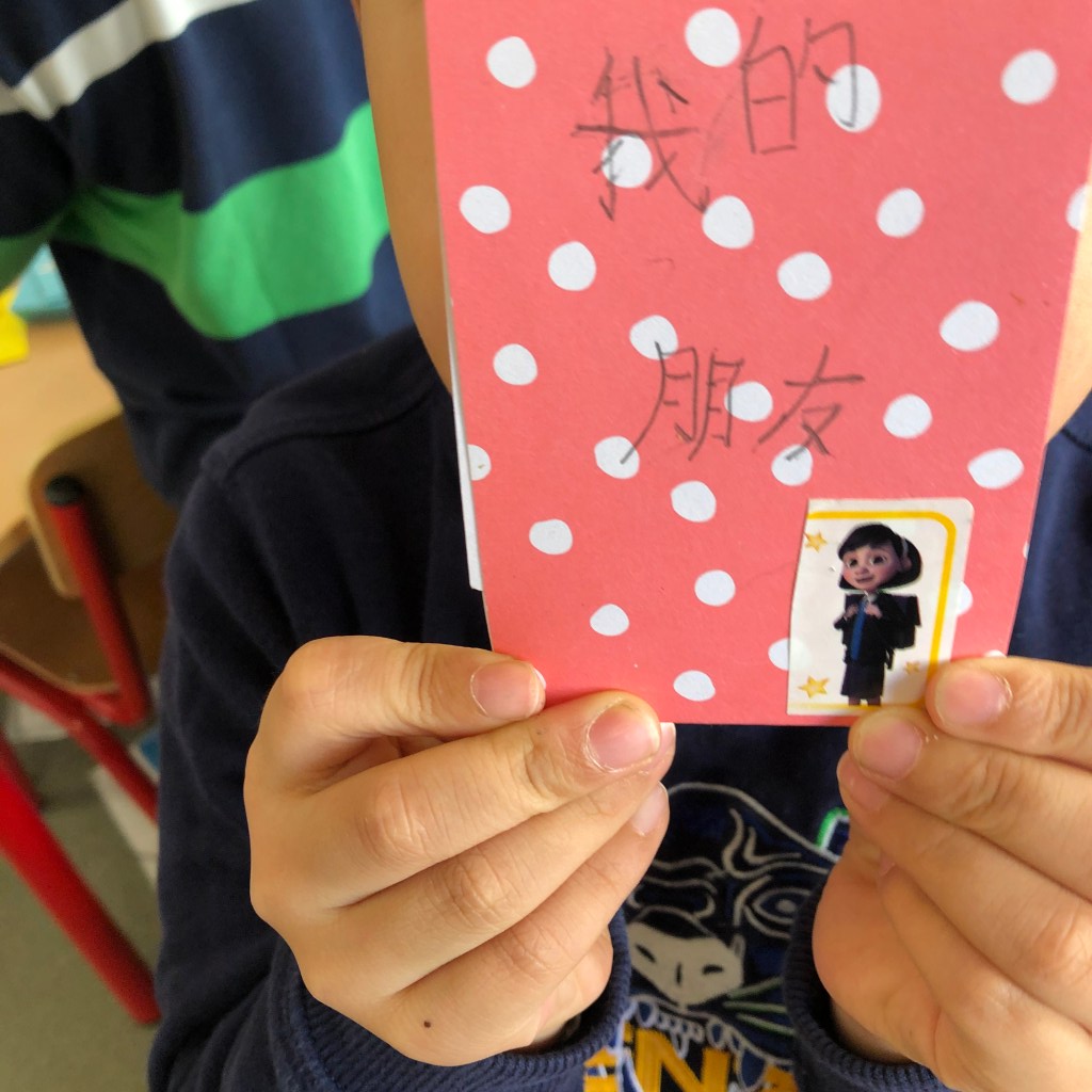 ESL conversation questions for Valentine's Day are used to make cards for classmates. This photo shows some cards with personal messages and decorations.